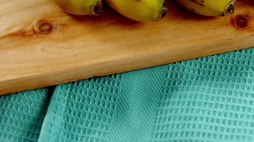 Close up of Ripe Yellow Bananas on Cutting Board