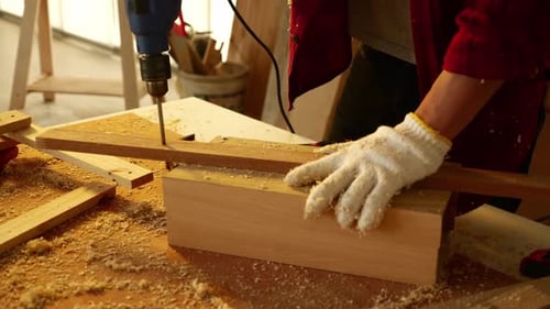 Woodwork and furniture making concept. Stylish craftsman working in his carpentry workshop