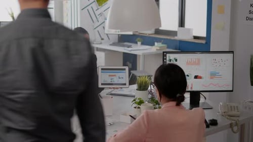 Women Reviewing Data in Protected Office Meeting