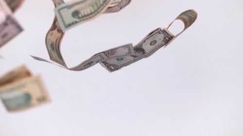 Dollar bills falling