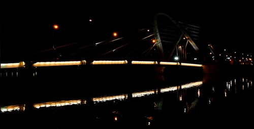Bridge Over River at Night