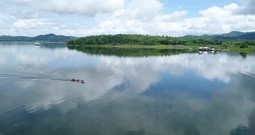 Aerial view of speed boats on the sea near beach city