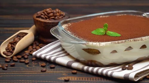 Delicious Tiramisu with Coffee Beans on Wooden Table
