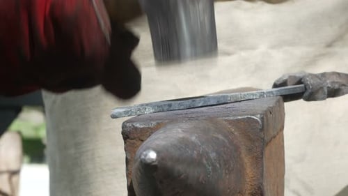 Smith Works with Metal