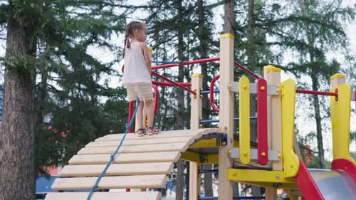 Little Girl Climbing Rope Playground Equipment Summer Day Public Park HappyActive Childhood Concept