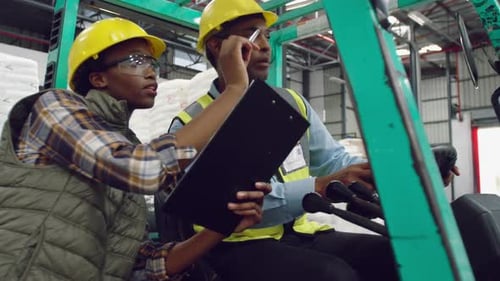 Workers interacting in a warehouse