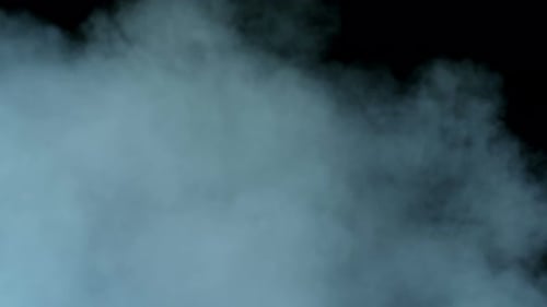 Dynamic Vaporous Mist Flowing on a Black Backdrop