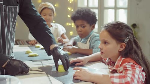 Girl Helping Chef with Cutting Fruit on Culinary Masterclass