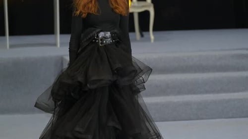 Fashionable Woman Posing Elegantly in Black Dress