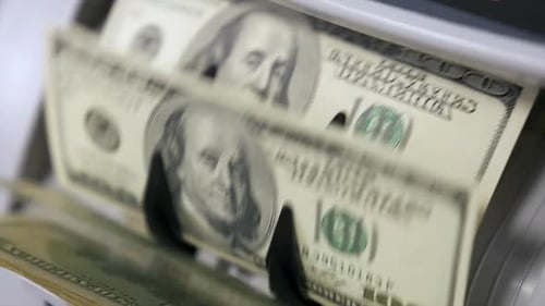 Money Counter Counts Stacks of One Hundred Bills