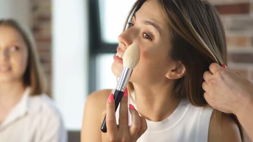 Professional Visagist Evaluates Make-up of Her Students