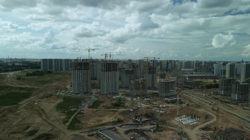 Construction site. Construction of multi-storey buildings. Construction of a city block. Aerial phot