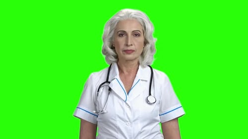 Senior Doctor Smiling on Chroma Key Background