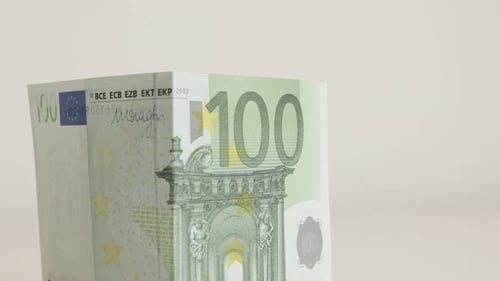 Tilting on EU paper money real estate construction on white background 4K 2160p 30fps UHD footage -