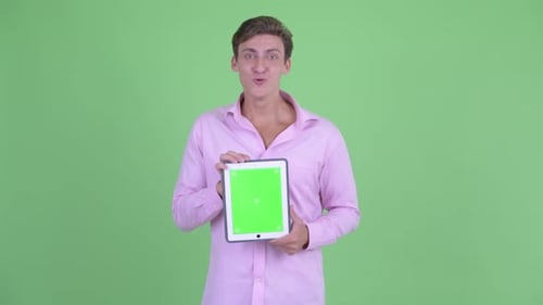Young Adult Holding Tablet with Green Screen Chroma Key