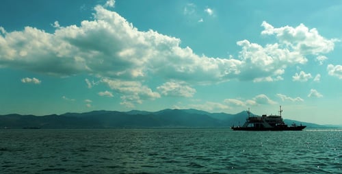 Boat Sailing on Calm Waters on a Sunny Day