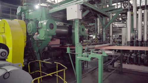 Metal Sheets Being Processed by Factory Machine