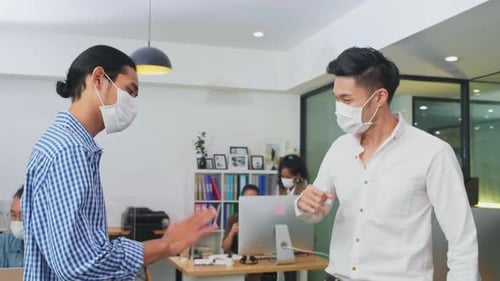 Group of Asian team business people working in office with new normal social distancing lifestyle