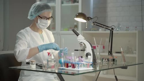 Scientist Working with Test Tubes in a Laboratory