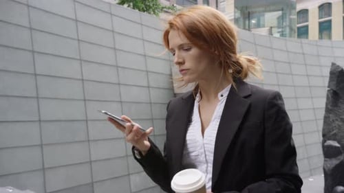 Woman Talking on Smartphone in Urban Setting