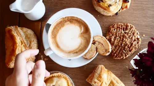 Pastries and Coffee on Wooden Table Overhead Shot