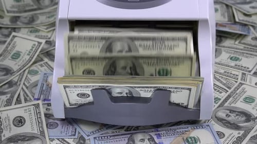 Money Counter Counts US Hundred Dollar Bills
