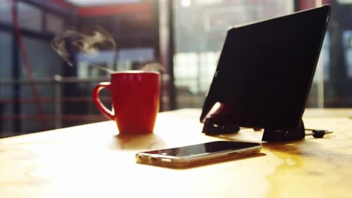 Tablet, Smartphone, and Mug on Office Desk