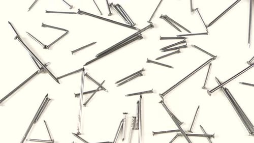 Collection of Metal Nails on White Background