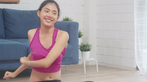 Woman Doing Yoga and Stretching at Home