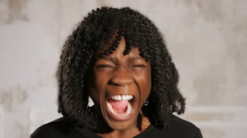 Emotional Afro American Lady Screams in Anger and Cries