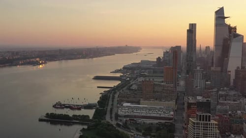 A high angle view of Manhattan's westside at sunrise on a hazy morning. The camera dolly in and pan
