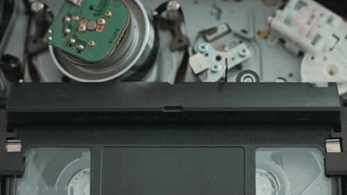 Rewind a VHS Tape Into a VCR Player