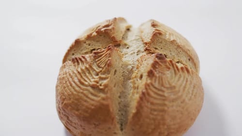 Video of bread on white worktop seeing from above