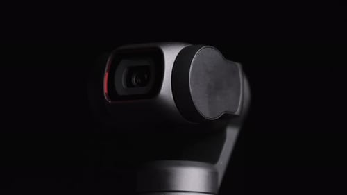 Rotating Black Camera on Black Background