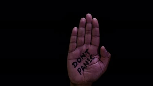 Hand Opens from Fist, Saying Don't Panic