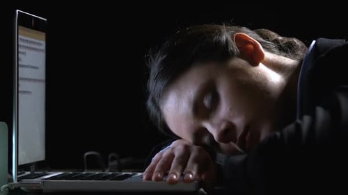 Woman Sleeping on Keyboard at Night