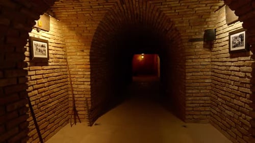 Dimly Lit Brick Tunnel with Archways