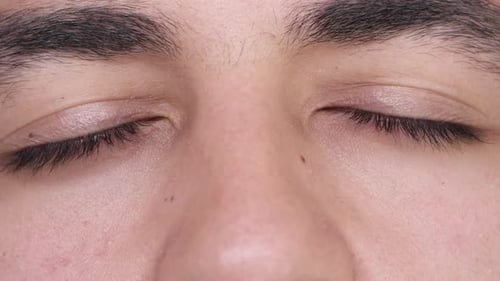 Close Up Footage of Closed Eyes Opening in Slowmotion