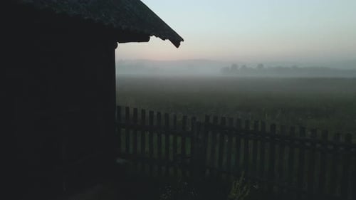 Foggy dawn in the countryside. Foggy river valley and rising sun. Aerial photography.