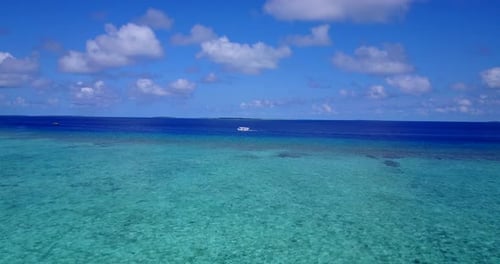 Wide drone clean view of a paradise sunny white sand beach and turquoise sea background in colorful