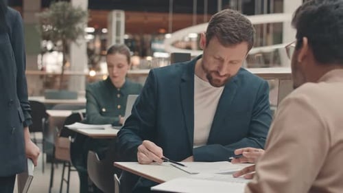 Businessmen Meeting in Cafe