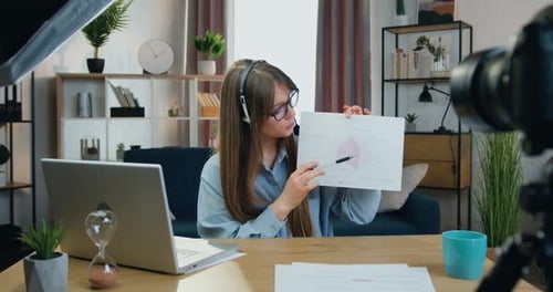Woman Presents Business Chart During Teleconference
