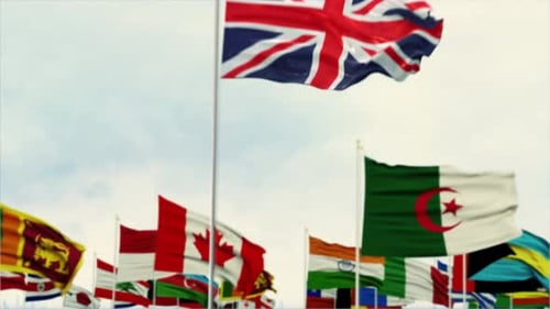 International Waving Flags Background with United Kingdom Focus