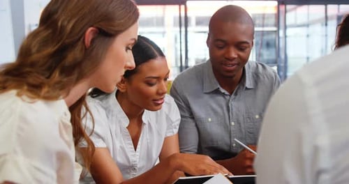Business Professionals Collaborating in Bright Modern Office