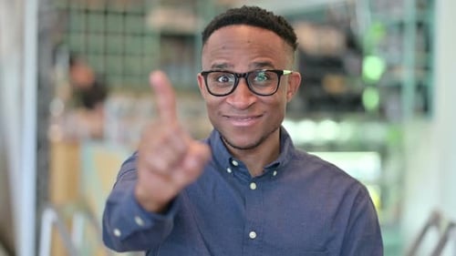 Happy Man Points Directly at the Viewer, Close Up