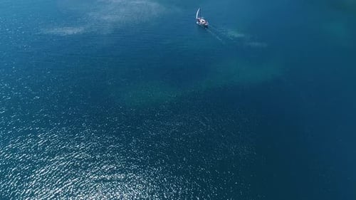 Aerial View of Sailboat in Tropical Blue Ocean