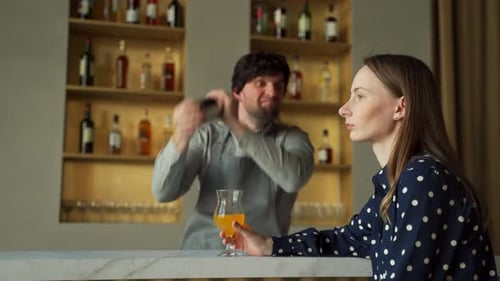 Crazy Bartender Shakes a Shaker at the Bar