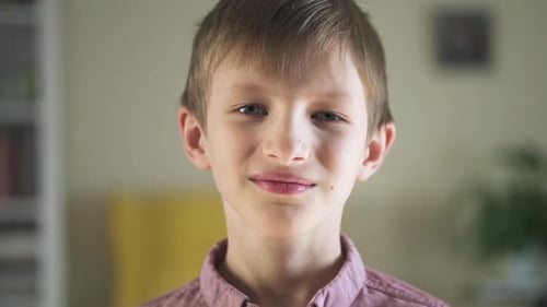 Smiling Child Looking at the Camera Indoors