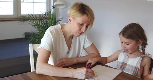 Woman and Girl Drawing Together at Home