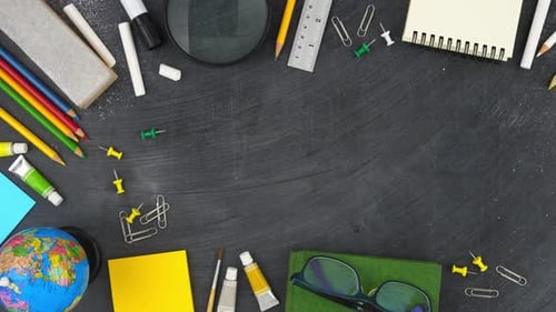 Education background with colorful stationery on blackboard top view border design with copy space